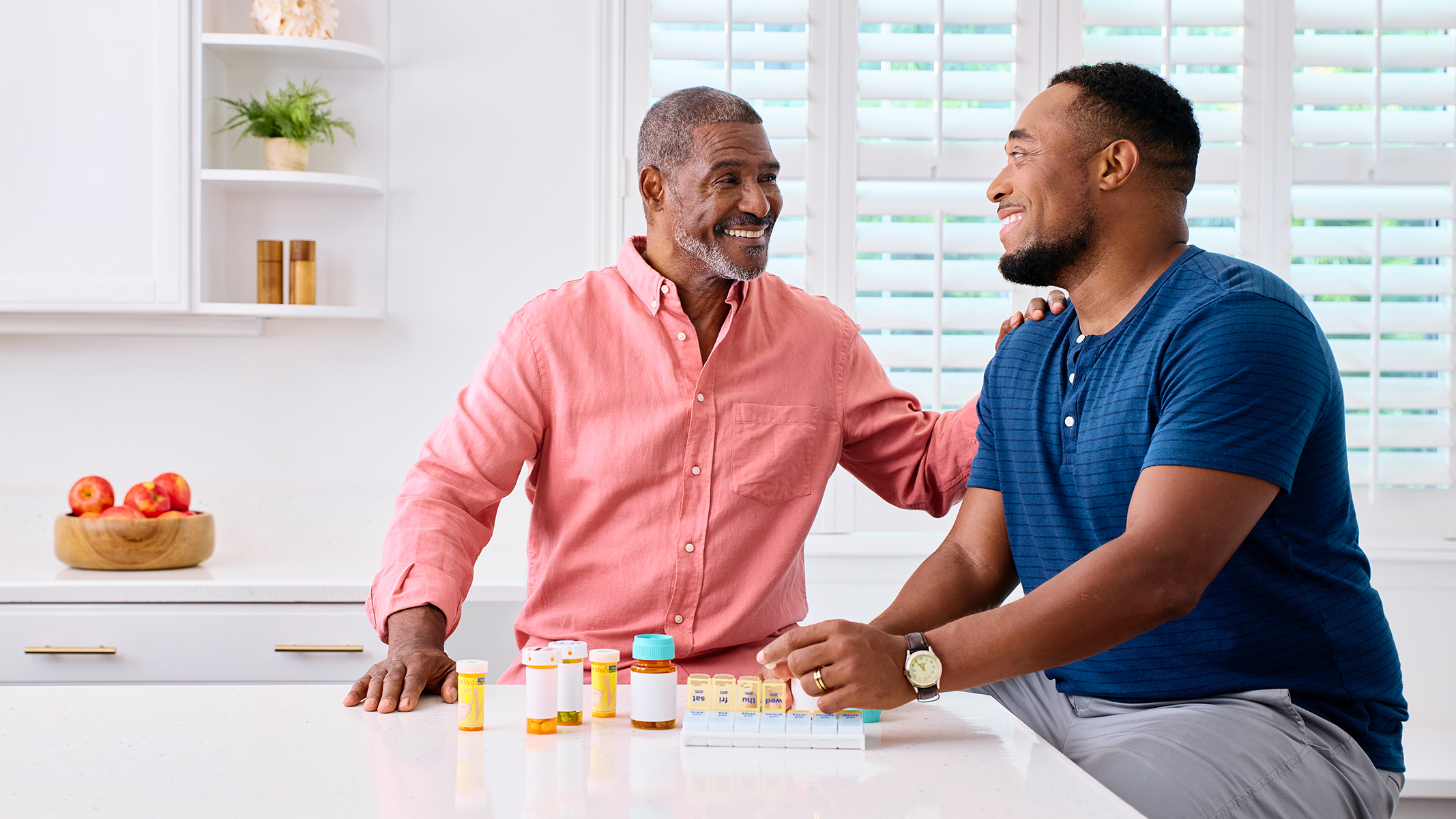 Father and son discussing prescription medications.