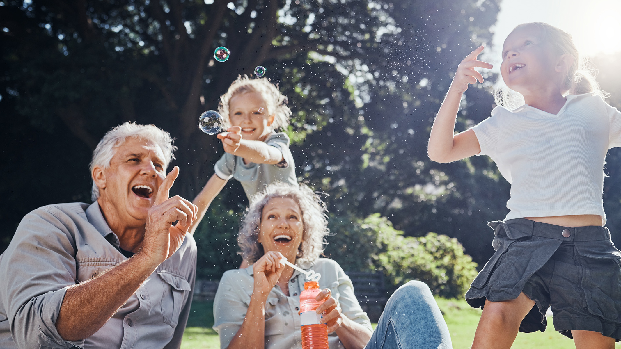 Senior couple spending time with their grandchild in the park.