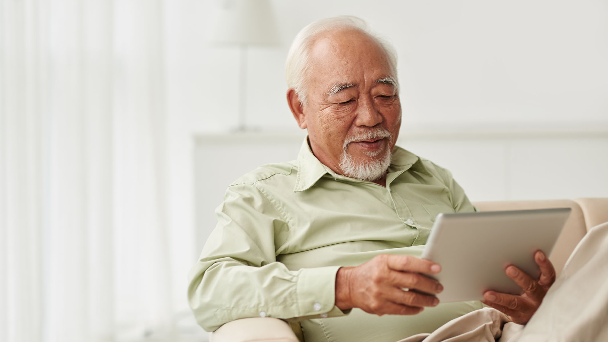 Senior man using tablet
